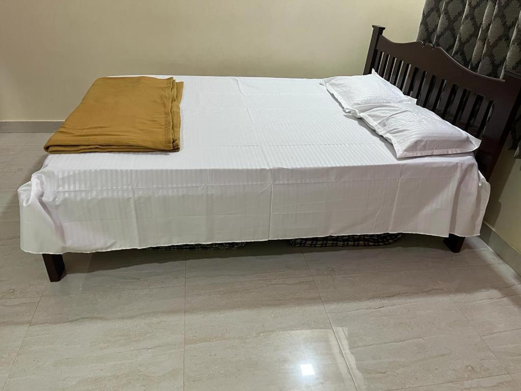 Postel nebo postele na pokoji v ubytování Suyog Homestay Malvan Monsoon Packages