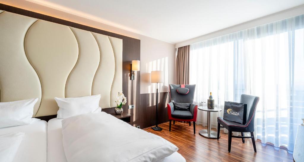 Postel nebo postele na pokoji v ubytování PLAZA Hotel Föhr am Bodensee