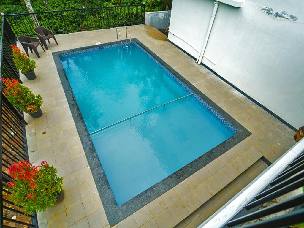 Bazén v ubytování Oasis Vythiri Pool Apartments nebo v jeho okolí