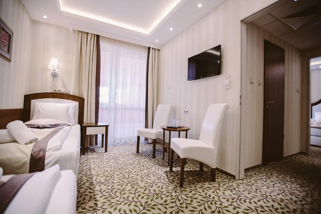 Telewizja i/lub zestaw kina domowego w obiekcie Elixír Medical Wellness Hotel
