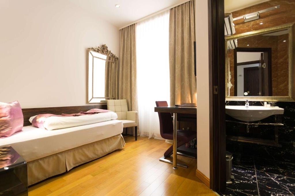 Postel nebo postele na pokoji v ubytování Best Western Plus Hotel Arcadia