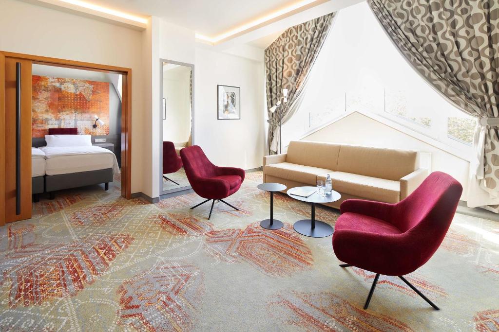 Postel nebo postele na pokoji v ubytování Best Western Plus Arosa Hotel