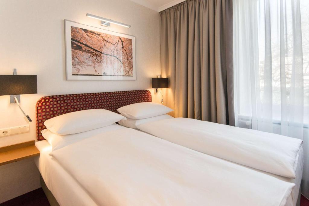 Postel nebo postele na pokoji v ubytování Best Western Plus Hotel St. Raphael