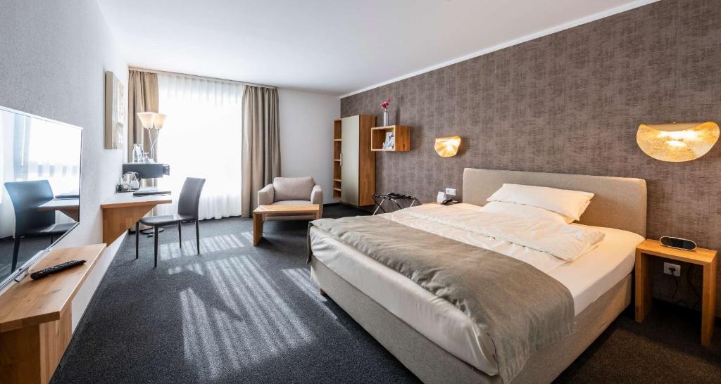 Postel nebo postele na pokoji v ubytování Best Western Plus iO Hotel