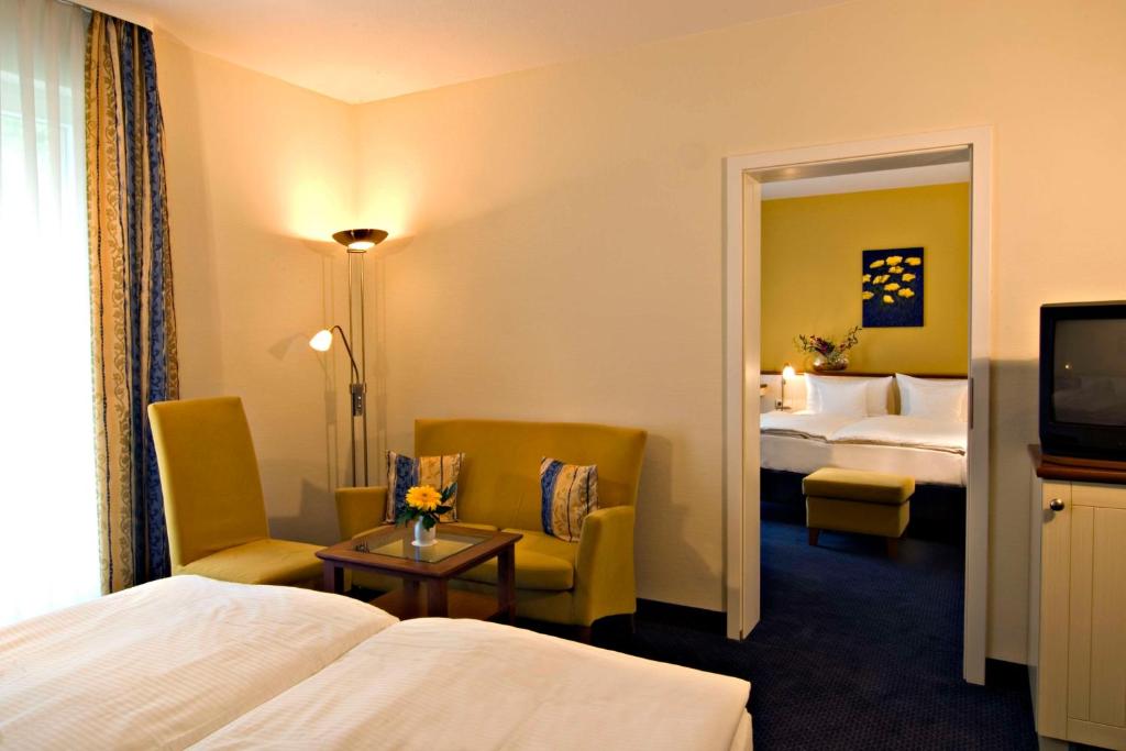 Postel nebo postele na pokoji v ubytování Best Western Plus Ostseehotel Waldschloesschen