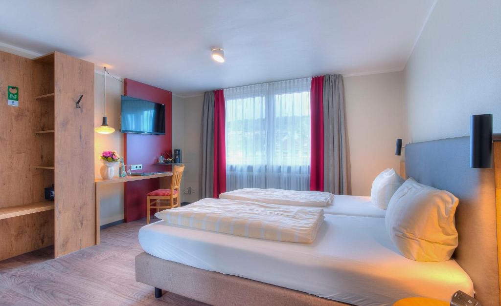 Postel nebo postele na pokoji v ubytování Best Western Hotel Brunnenhof