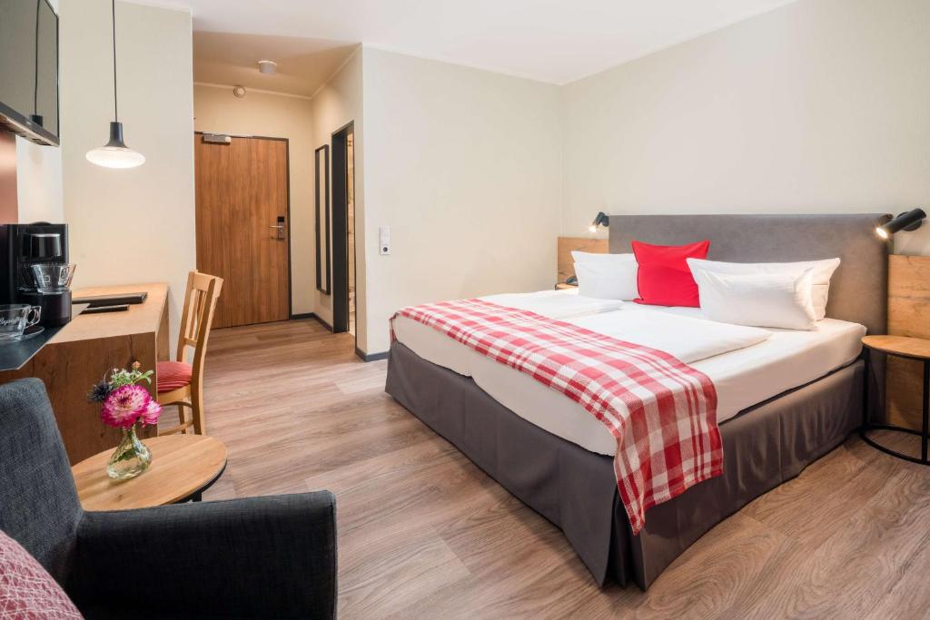 Postel nebo postele na pokoji v ubytování Best Western Hotel Brunnenhof