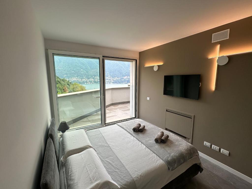 Ένα ή περισσότερα κρεβάτια σε δωμάτιο στο Luxury Lake View Apartment - Lake Como - Cernobbio