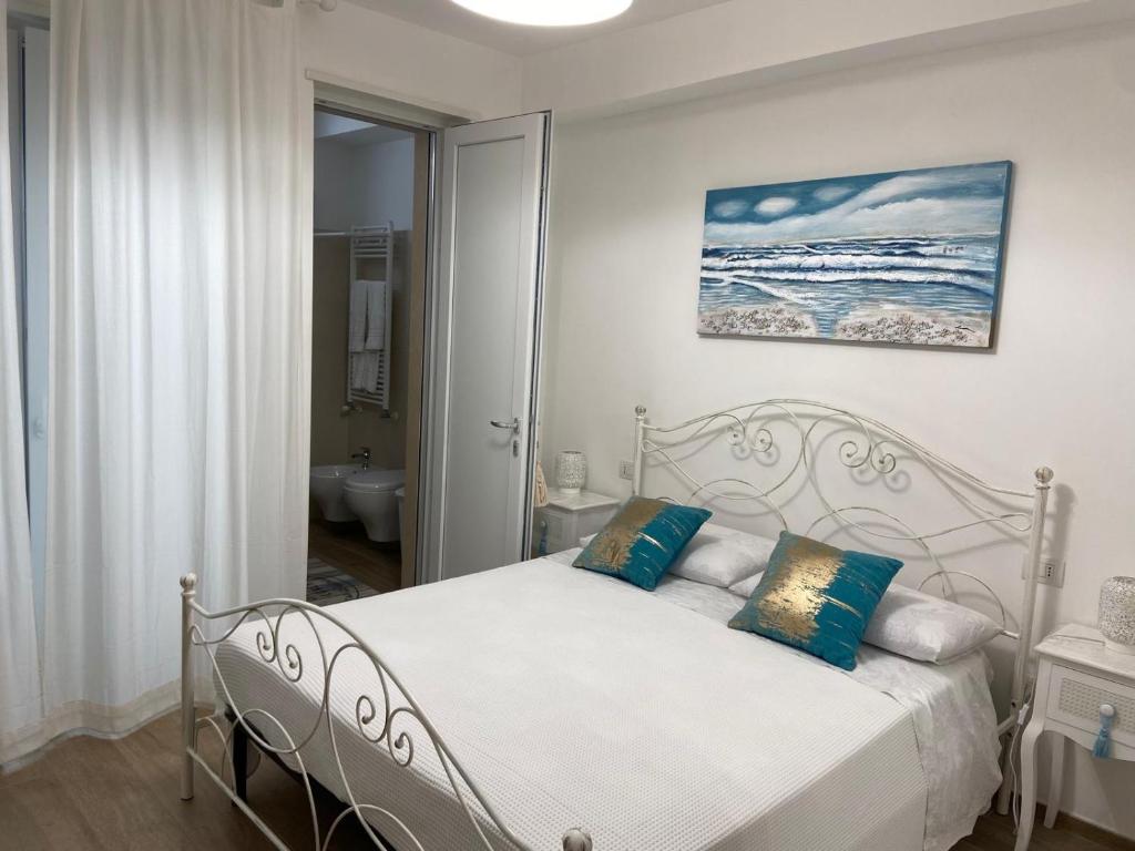 Postel nebo postele na pokoji v ubytování Amare il Mare