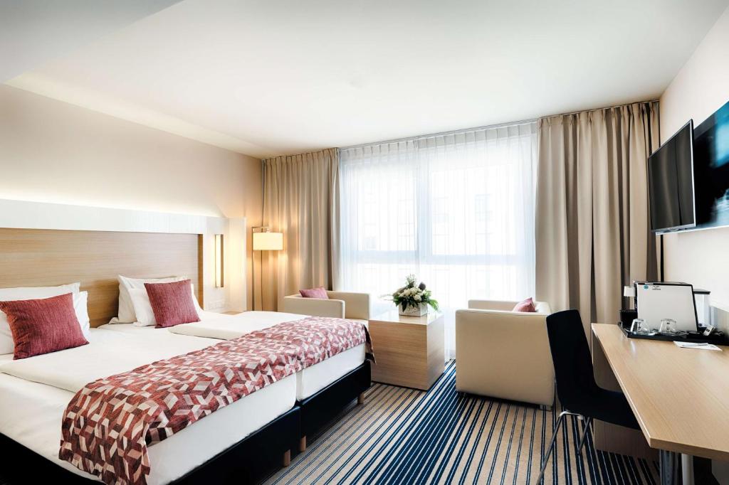 Postel nebo postele na pokoji v ubytování Best Western Plus Welcome Hotel Frankfurt