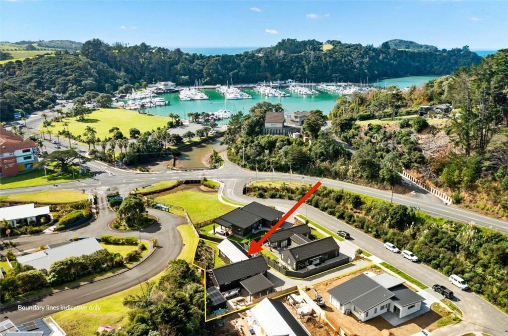 an aerial view of a town with a marina at Luxury stay in Tutukaka in Whangarei