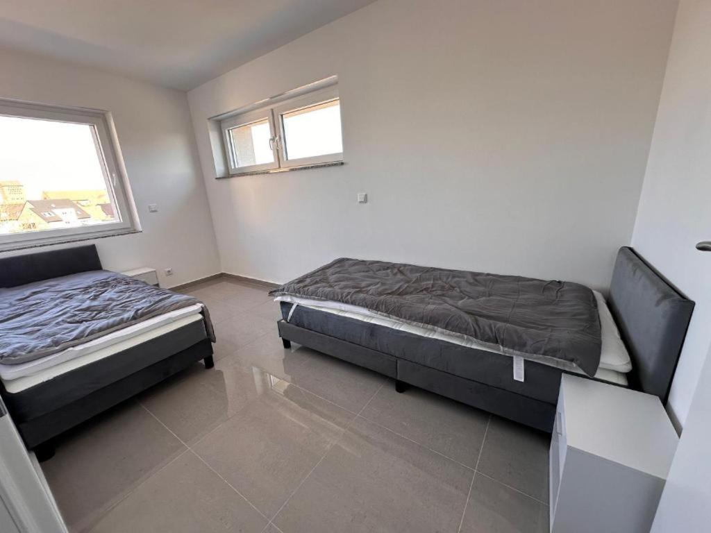Ένα ή περισσότερα κρεβάτια σε δωμάτιο στο GM Ferienwohnung 3