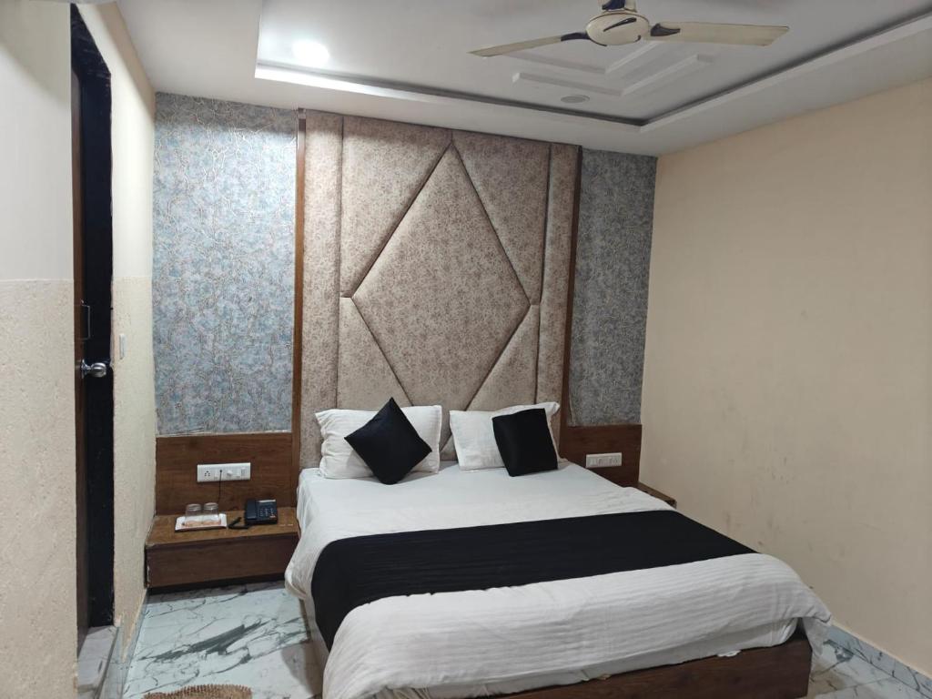 Postel nebo postele na pokoji v ubytování Hotel Royal King