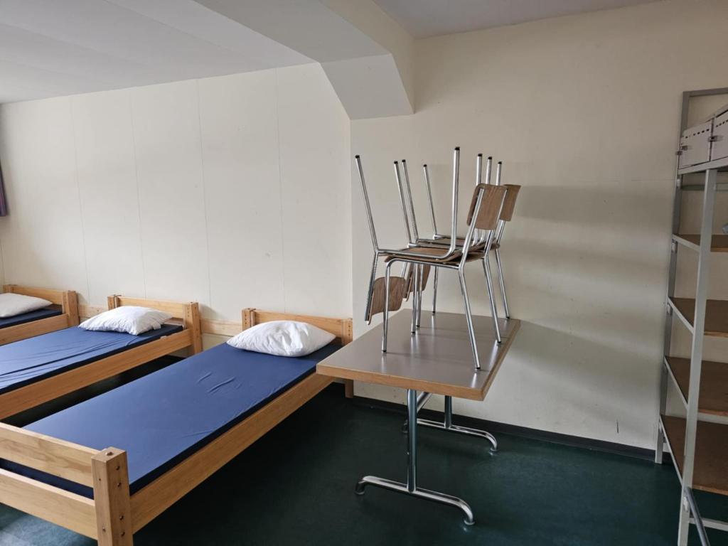Postel nebo postele na pokoji v ubytování LA Xenia located at Sportcamp Melchtal