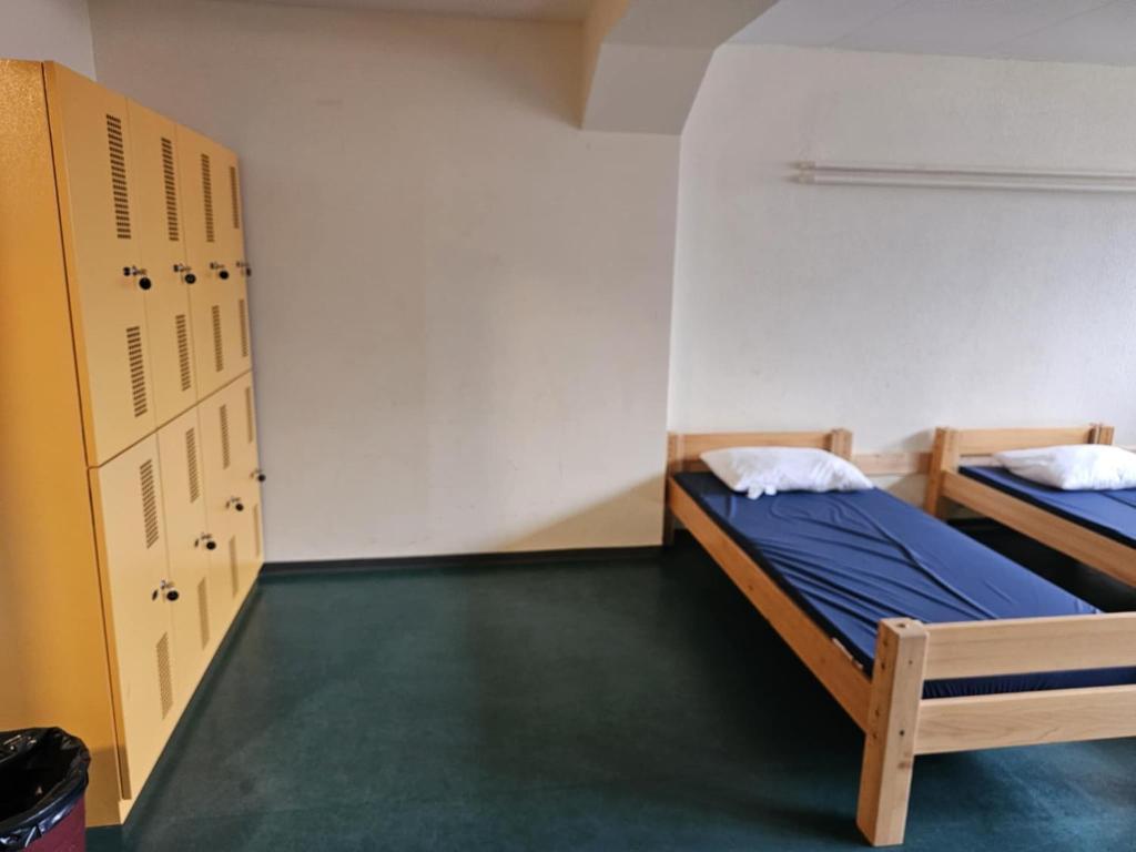 Postel nebo postele na pokoji v ubytování LA Xenia located at Sportcamp Melchtal