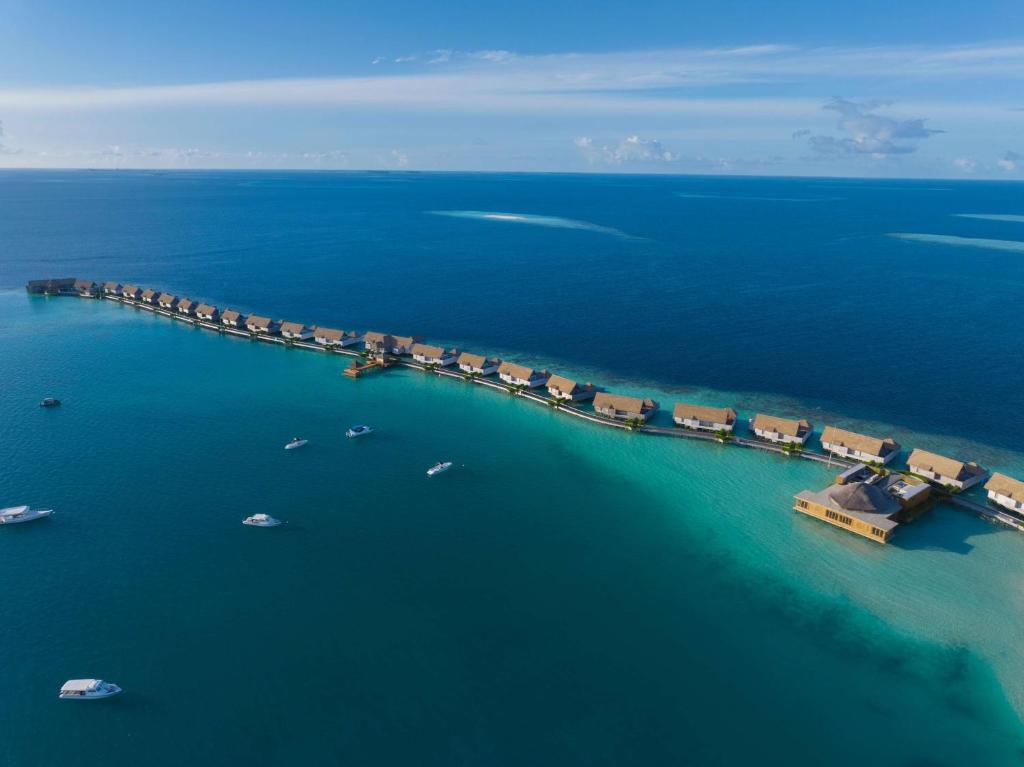 an aerial view of a dock in the water at Waldorf Astoria Maldives Ithaafushi in South Male Atoll