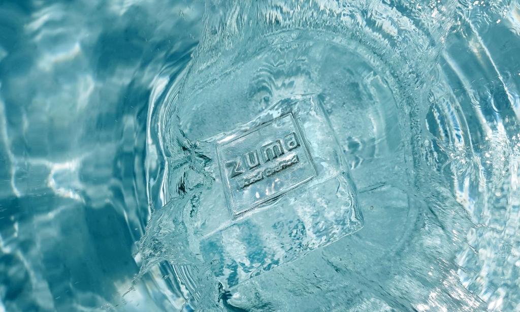a close up of a glass vase with a sticker on it at Waldorf Astoria Maldives Ithaafushi in South Male Atoll