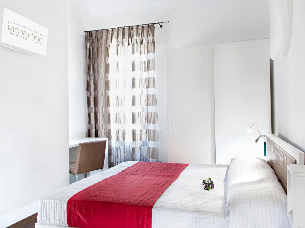 Łóżko lub łóżka w pokoju w obiekcie Iamartino Quality Rooms