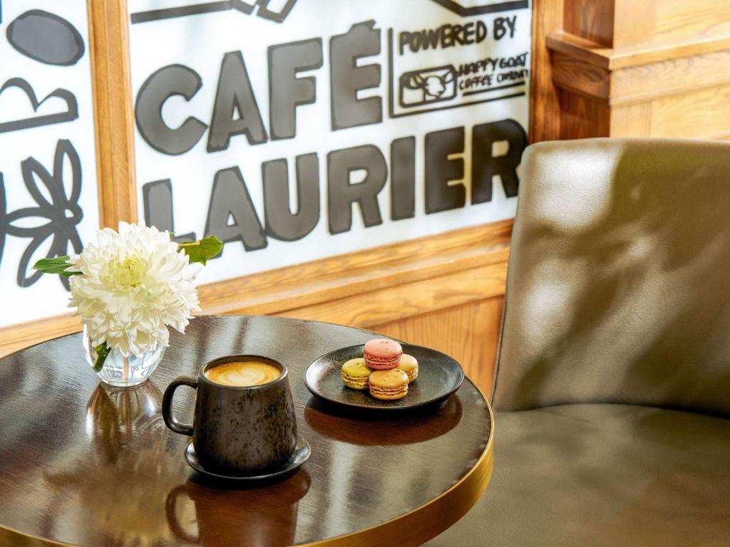 a table with a cup of coffee and pastries on it at Fairmont Chateau Laurier in Ottawa