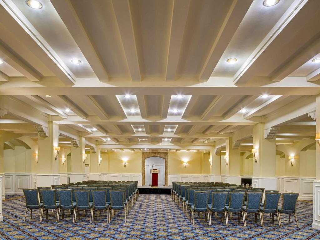 a large room with chairs and a stage in it at Fairmont Chateau Laurier in Ottawa