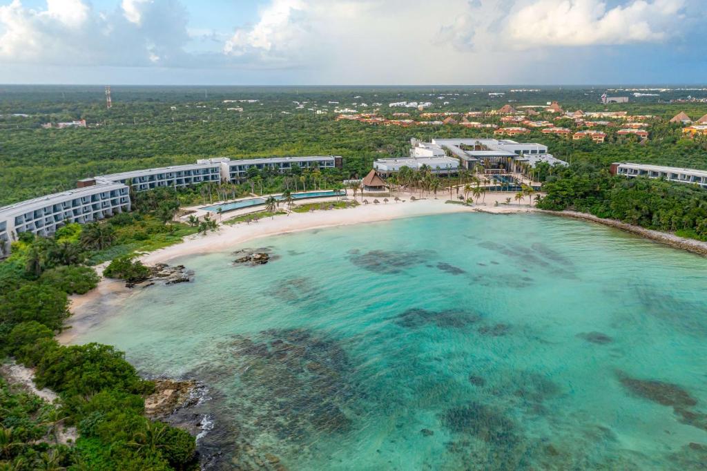 an aerial view of a beach and a resort at Conrad Tulum Riviera Maya in Tulum