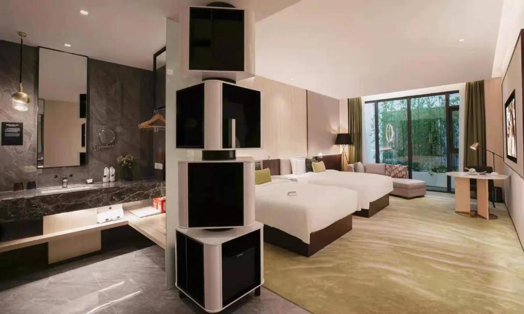 Ένα ή περισσότερα κρεβάτια σε δωμάτιο στο Wuhan Hazens Hotel