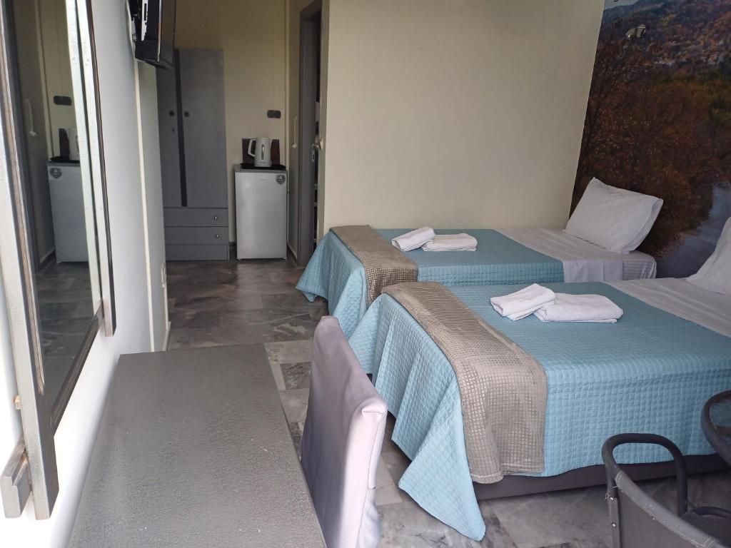Postel nebo postele na pokoji v ubytování Enalion Beach Hotel