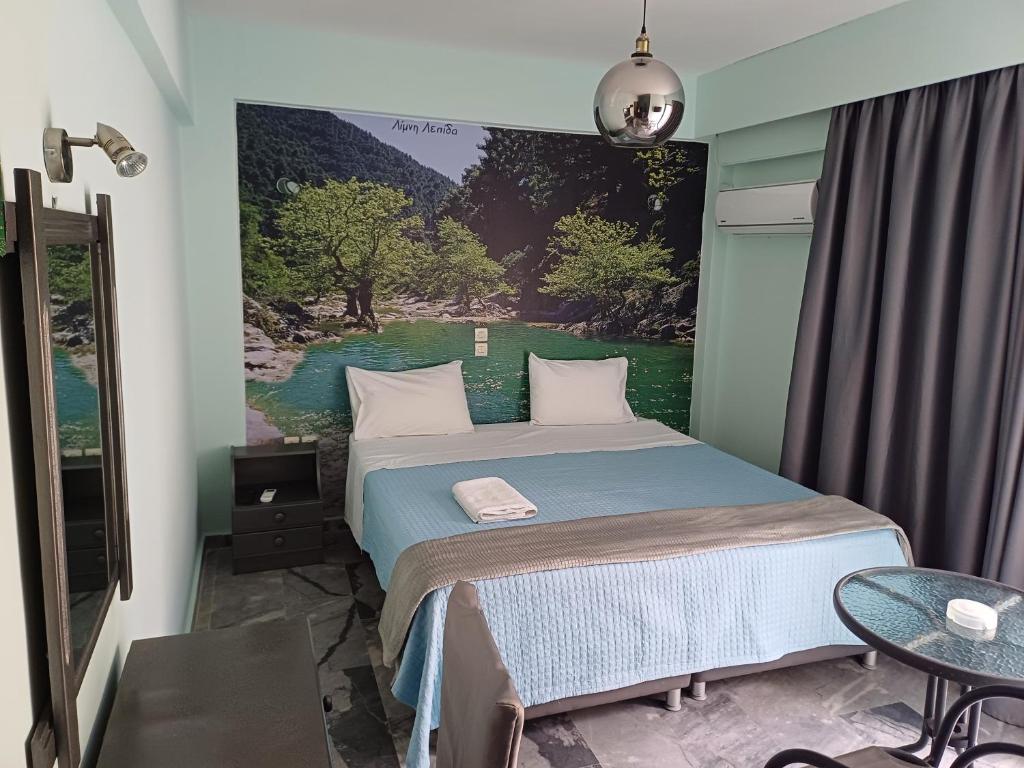 Postel nebo postele na pokoji v ubytování Enalion Beach Hotel