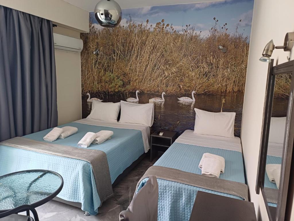 Postel nebo postele na pokoji v ubytování Enalion Beach Hotel