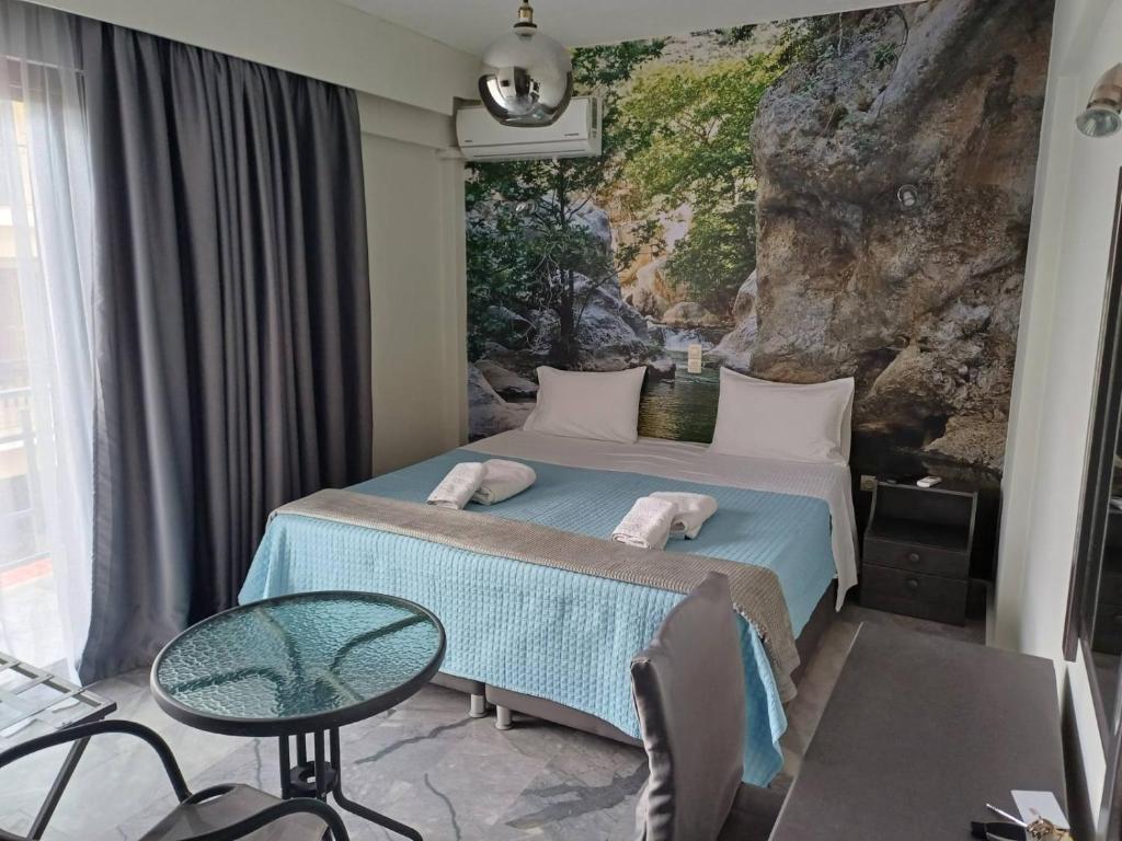 Postel nebo postele na pokoji v ubytování Enalion Beach Hotel