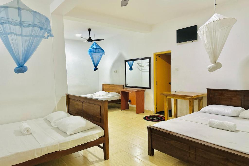 Postel nebo postele na pokoji v ubytování Gamagedara Resort