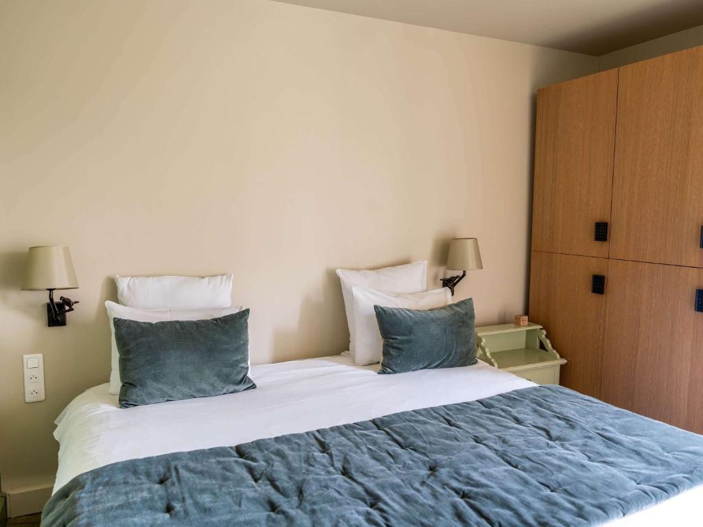 Postel nebo postele na pokoji v ubytování Hotel Mercure Parc du Coudray - Barbizon