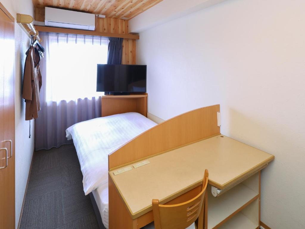 TV a/nebo společenská místnost v ubytování Tennen Onsen Taho-no-Yu Dormy Inn Niigata