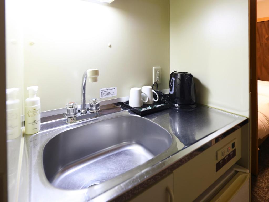 Kuchyň nebo kuchyňský kout v ubytování Tennen Onsen Taho-no-Yu Dormy Inn Niigata