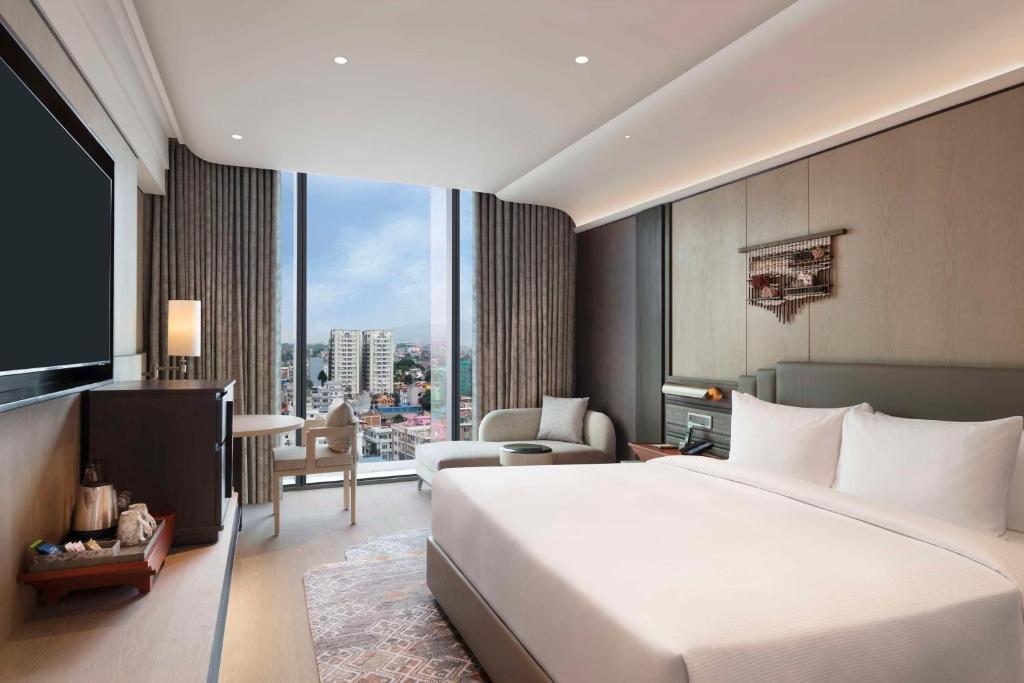 Postel nebo postele na pokoji v ubytování Hilton Kathmandu