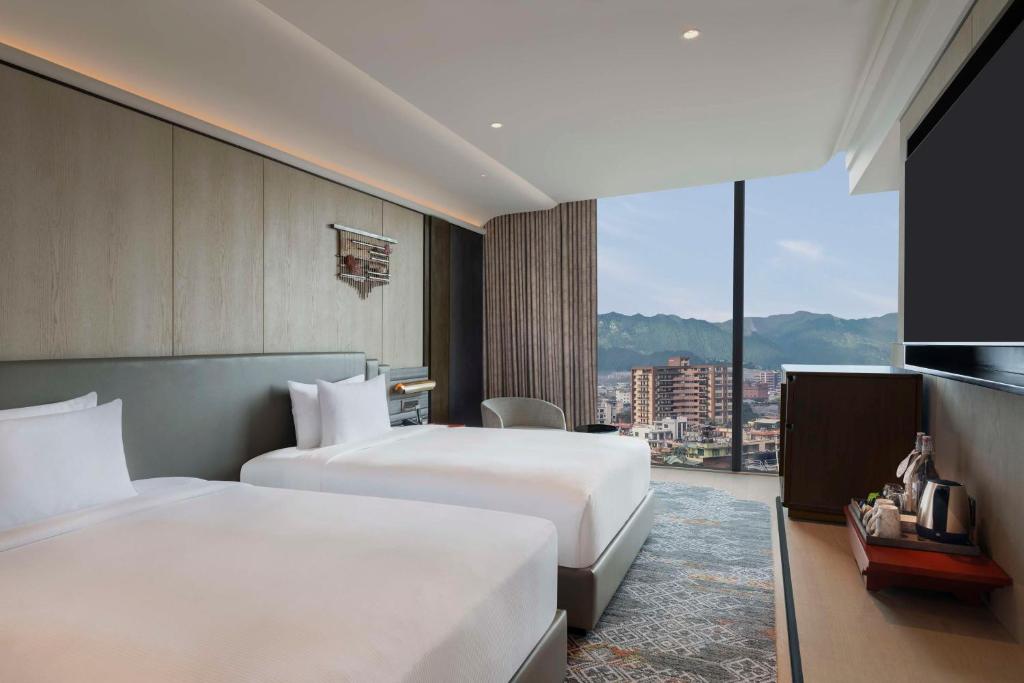 Postel nebo postele na pokoji v ubytování Hilton Kathmandu