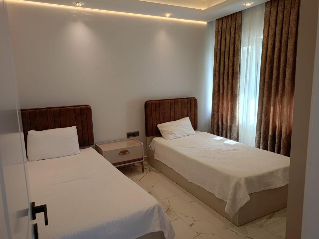 A bed or beds in a room at Elite Luxury Suite & Spa