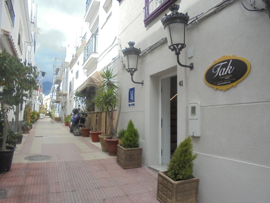 a street with a sign on the side of a building at TAK Boutique Old Town in Marbella