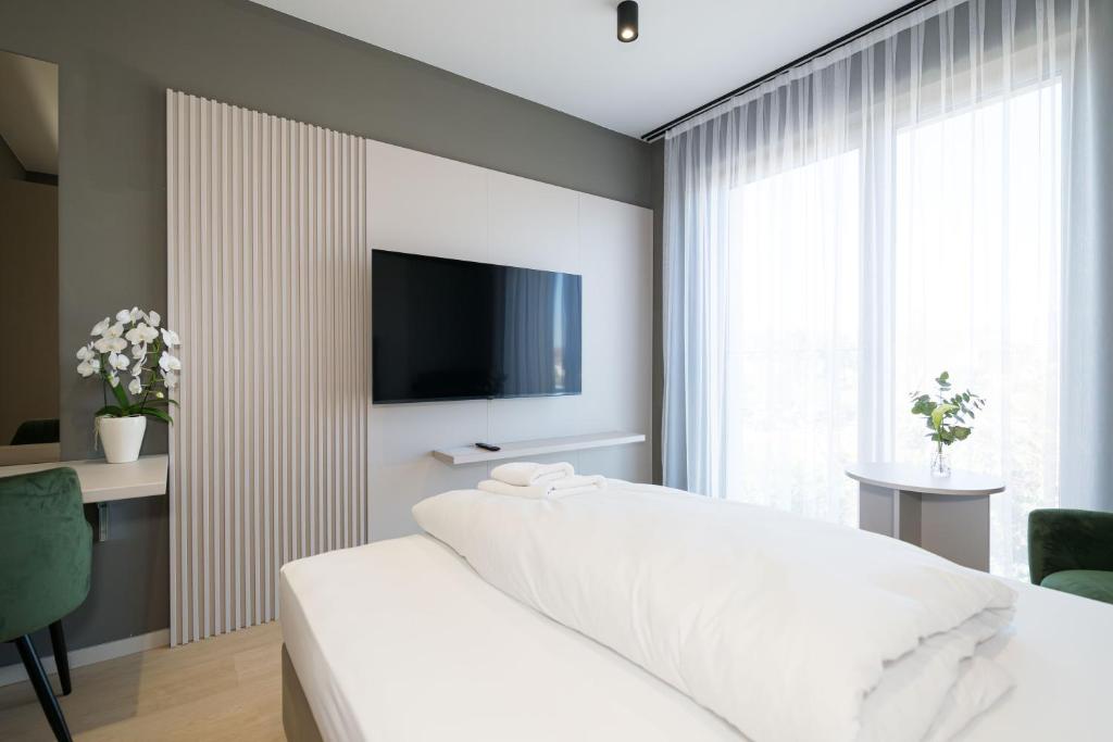 Postel nebo postele na pokoji v ubytování Taunus Suites