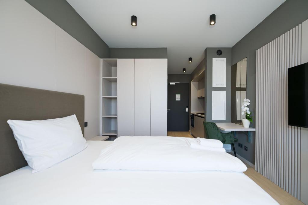 Postel nebo postele na pokoji v ubytování Taunus Suites