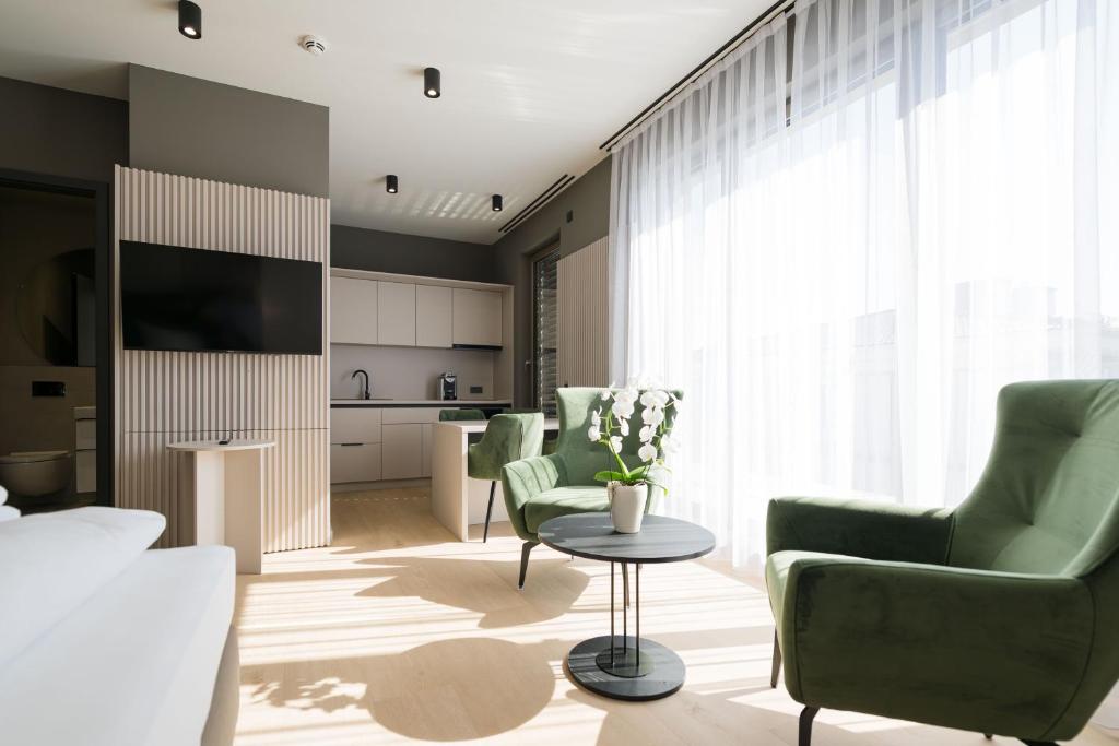 TV a/nebo společenská místnost v ubytování Taunus Suites