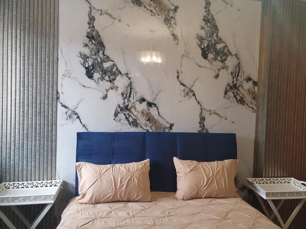 A bed or beds in a room at Didi House