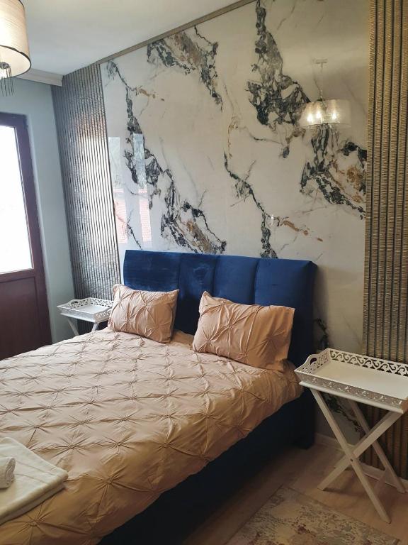 A bed or beds in a room at Didi House