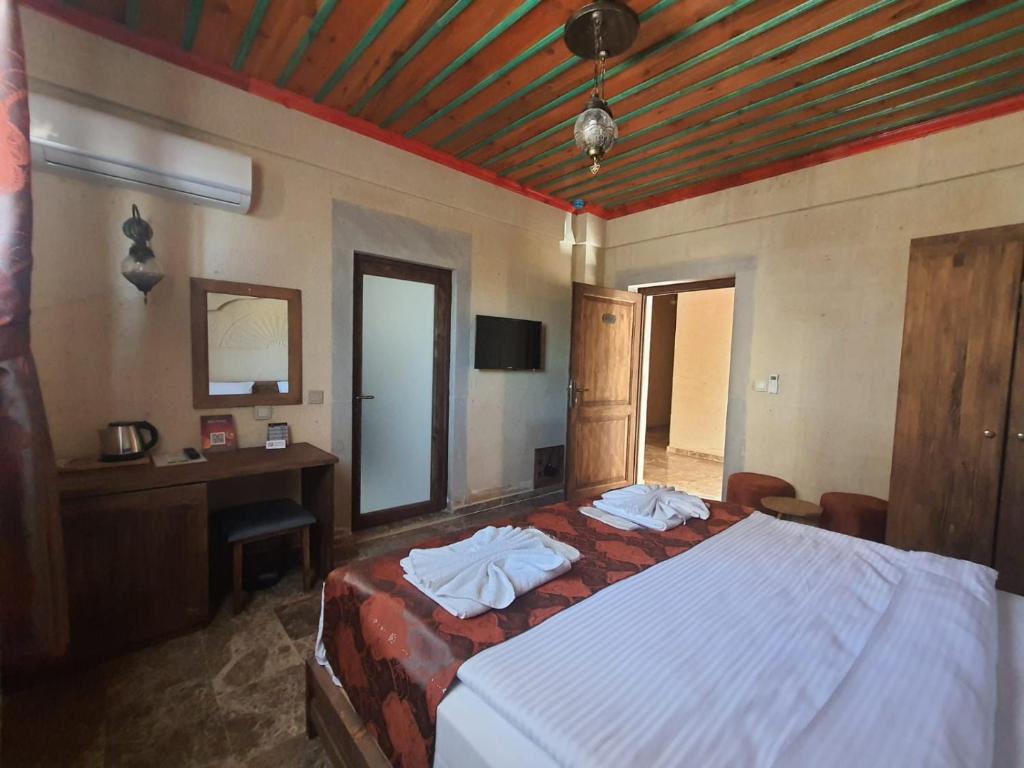 Postel nebo postele na pokoji v ubytování Cordial Cappadocia Hotel