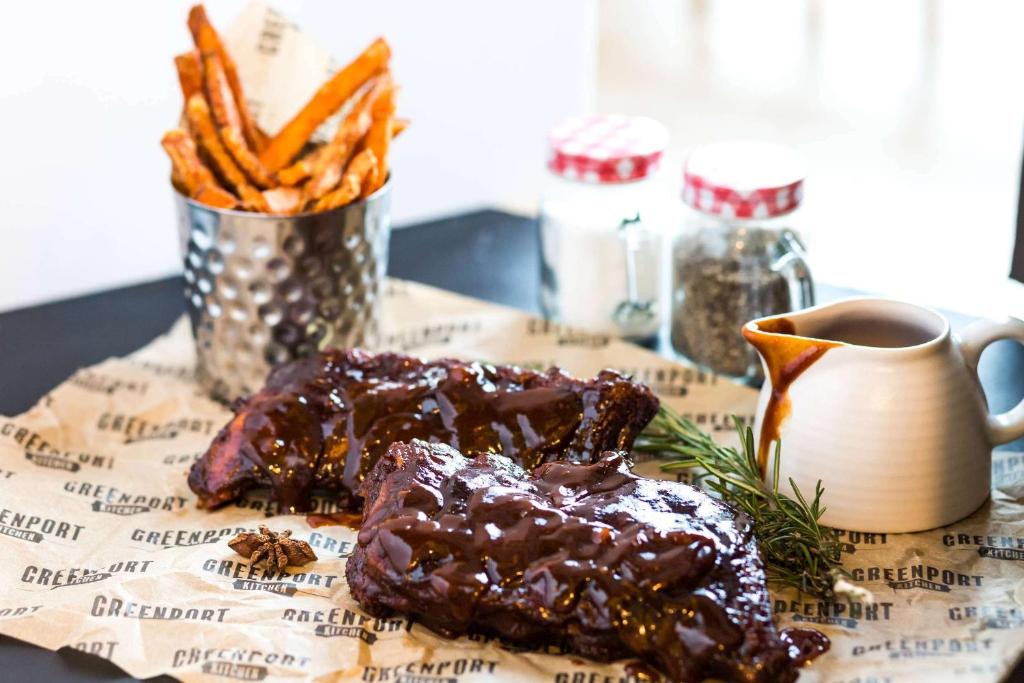 a plate of food with meat and fries and a cup of coffee at Hampton by Hilton London Waterloo in London