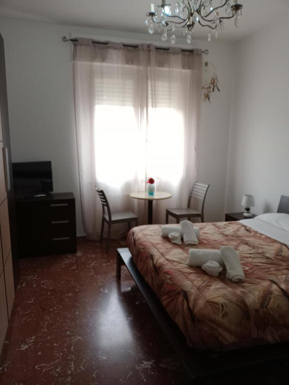 Postel nebo postele na pokoji v ubytování B&B Lo Scrigno