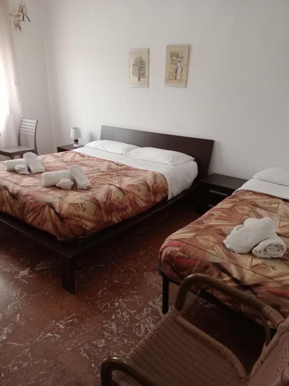Postel nebo postele na pokoji v ubytování B&B Lo Scrigno