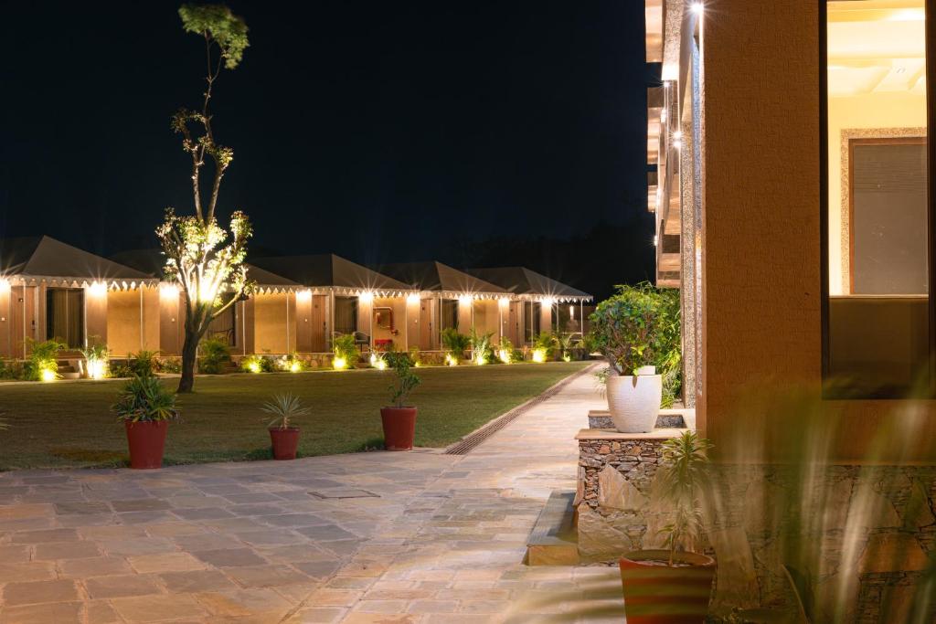 a courtyard at night with plants and lights at Imperia Resort by The Sky Imperial, Nathdwara in Nāthdwāra