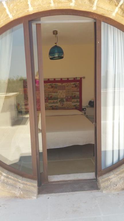 Posteľ alebo postele v izbe v ubytovaní Masseria Le Celline