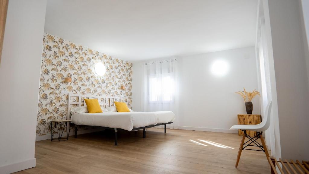 En eller flere senge i et værelse på Casa del Mar